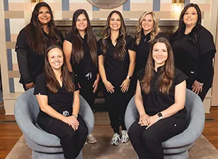 The Keep Smiling Waco team in black scrubs