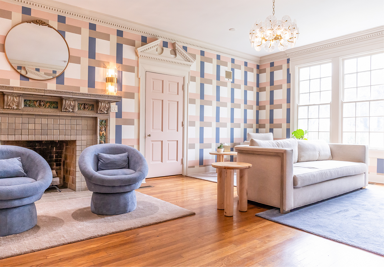 Wide open room with hardwood floors and a fireplace