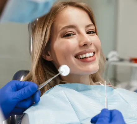 Woman smiling right before her dental exam