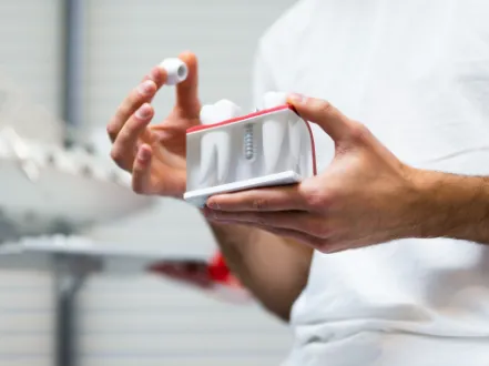 Placing a dental crown on a model of a dental implant